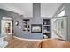Living space includes a fireplace, built-in shelving, a coffee bar, and views of the dining area at 5631 Silver Bluff Ct, Parker, CO 80134