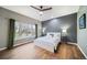 Large bedroom with hardwood floors, a modern ceiling fan, and natural light at 5631 Silver Bluff Ct, Parker, CO 80134
