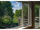 Scenic window view of green pastures, mature trees and outdoor deck at 5631 Silver Bluff Ct, Parker, CO 80134