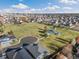An aerial view of a suburban neighborhood highlighting a park with playgrounds and walking paths, promoting an active lifestyle at 410 Clover Ct, Frederick, CO 80530