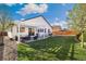 Large backyard showcasing a patio with outdoor seating, a grill, and a trampoline, perfect for Gathering gatherings at 410 Clover Ct, Frederick, CO 80530