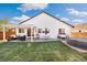 Spacious backyard with a patio, grill, and trampoline, offering ample space for outdoor activities and relaxation at 410 Clover Ct, Frederick, CO 80530