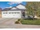 Beautiful two-story house featuring a three-car garage, well-maintained lawn, and a delightful front yard at 410 Clover Ct, Frederick, CO 80530