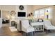 The living room features a fireplace, mounted TV, and large windows at 410 Clover Ct, Frederick, CO 80530