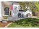 Inviting front porch with rocking chairs, potted plants, and well-maintained landscaping at 410 Clover Ct, Frederick, CO 80530