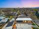 An aerial view of the modern home showcasing its rooftop deck and surrounding neighborhood at 2926 S Cherokee St, Englewood, CO 80110