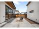 Modern backyard with a concrete patio, fire pit, and low-maintenance landscaping, perfect for outdoor entertaining at 2926 S Cherokee St, Englewood, CO 80110