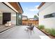Stylish backyard patio with modern firepit, seating, and doors to interior living space at 2926 S Cherokee St, Englewood, CO 80110