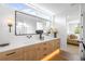 Stylish bathroom with double vanity, contemporary fixtures, and access to a glass-enclosed shower at 2926 S Cherokee St, Englewood, CO 80110