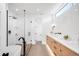 Contemporary bathroom featuring double sink vanity, glass shower and free-standing tub at 2926 S Cherokee St, Englewood, CO 80110