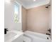 Bathroom with large format tile, modern vanity and shower/tub combo at 2926 S Cherokee St, Englewood, CO 80110