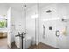 Bathroom featuring a modern bathtub, sleek glass shower, and elegant fixtures at 2926 S Cherokee St, Englewood, CO 80110