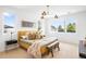 Bright bedroom with natural light, neutral decor, and a cozy, inviting atmosphere at 2926 S Cherokee St, Englewood, CO 80110