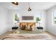 Bright and airy bedroom featuring a bed with accent pillows and ambient bedside lighting at 2926 S Cherokee St, Englewood, CO 80110