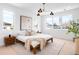 Bright bedroom featuring a bed, modern lighting, and large windows with natural light at 2926 S Cherokee St, Englewood, CO 80110