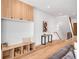 Stylish entryway with custom built-in shelving, bench seating, and wood floors, creating a welcoming first impression at 2926 S Cherokee St, Englewood, CO 80110