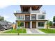 Modern townhome showcases a roof deck, stylish facade, and well-manicured lawn at 2926 S Cherokee St, Englewood, CO 80110