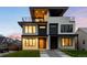 Modern home featuring a front yard and an elevated balcony for outdoor living at 2926 S Cherokee St, Englewood, CO 80110