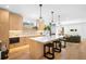 Contemporary kitchen features a large island, modern finishes, and open layout at 2926 S Cherokee St, Englewood, CO 80110