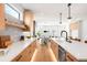 Modern kitchen featuring an open layout, stainless appliances, and hardwood floors at 2926 S Cherokee St, Englewood, CO 80110