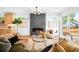 Inviting living room with a modern fireplace, stylish furniture, and an open concept design at 2926 S Cherokee St, Englewood, CO 80110