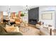 Spacious living room with a fireplace, stylish decor, and an open flow to the kitchen at 2926 S Cherokee St, Englewood, CO 80110