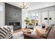 Open living area featuring a fireplace, stylish decor, and sliding glass doors at 2926 S Cherokee St, Englewood, CO 80110