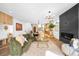 Open-concept living space seamlessly connects to a modern kitchen with a cozy fireplace feature at 2926 S Cherokee St, Englewood, CO 80110