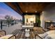 Relaxing outdoor living space with a fireplace, comfortable seating, and scenic views at 2926 S Cherokee St, Englewood, CO 80110