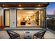 Open patio with a fire pit and folding glass doors to the interior at 2926 S Cherokee St, Englewood, CO 80110
