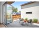 Modern patio with sleek furniture, open to indoor space, surrounded by contemporary home design at 2926 S Cherokee St, Englewood, CO 80110