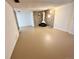 Basement featuring vintage stone fireplace, neutral flooring, and white walls at 414 S Nelson S St, Lakewood, CO 80226