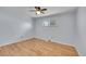 Bright bedroom with wood floors, neutral walls, and natural light streaming through the windows at 414 S Nelson S St, Lakewood, CO 80226