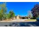 Charming single-story home with brick facade, covered parking, and a well-manicured front yard at 414 S Nelson S St, Lakewood, CO 80226
