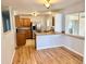 Bright kitchen featuring stainless steel refrigerator, granite countertops and an eat-in breakfast nook at 414 S Nelson S St, Lakewood, CO 80226