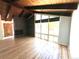 Bright living room featuring vaulted wood ceiling, hardwood floors, brick fireplace and large windows at 414 S Nelson S St, Lakewood, CO 80226