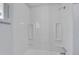 Shower stall with white wall panels and two inset shelves for storage at 414 S Nelson S St, Lakewood, CO 80226