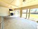 Sunroom featuring sliding glass doors, fireplace, and backyard view at 414 S Nelson S St, Lakewood, CO 80226