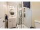Modern bathroom with glass shower, stylish vanity, and contemporary tile work at 7901 E Kenyon Dr, Denver, CO 80237