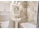 Cozy bathroom with mosaic tile backsplash, modern vanity, and bathtub-shower combo at 7901 E Kenyon Dr, Denver, CO 80237