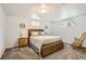 Basement bedroom features comfortable decor, neutral carpet, and plenty of natural light at 7901 E Kenyon Dr, Denver, CO 80237