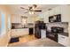 Modern kitchen featuring white cabinets, sleek countertops, and black appliances for a contemporary feel at 7901 E Kenyon Dr, Denver, CO 80237