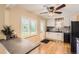Functional kitchen featuring updated countertops, modern backsplash, and stainless steel appliances at 7901 E Kenyon Dr, Denver, CO 80237
