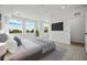 Bright bedroom with large windows and a flat-screen TV at 1418 Pierce St, Lakewood, CO 80214