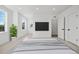 Bright bedroom with large windows and a flat-screen TV at 1418 Pierce St, Lakewood, CO 80214