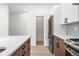 Modern kitchen with stainless steel appliances and an island at 1418 Pierce St, Lakewood, CO 80214