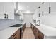 Modern kitchen with stainless steel appliances and an island at 1418 Pierce St, Lakewood, CO 80214