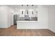 Modern kitchen with stainless steel appliances and an island at 1418 Pierce St, Lakewood, CO 80214