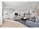 Open concept living area with kitchen and stairs at 1418 Pierce St, Lakewood, CO 80214