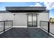 Private rooftop deck with composite decking and city views at 1418 Pierce St, Lakewood, CO 80214